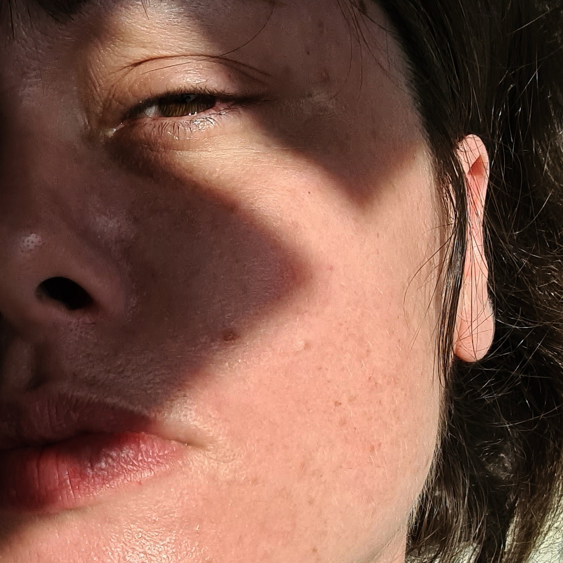 A sweaty day on my deck, shadows cast across my face from the shelf above me.