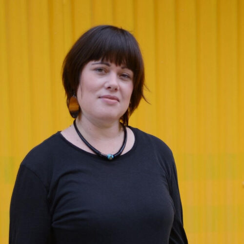 Willow Paule headshot on yellow background