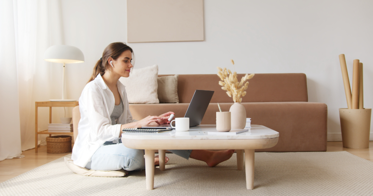 woman working on a laptop in her living room