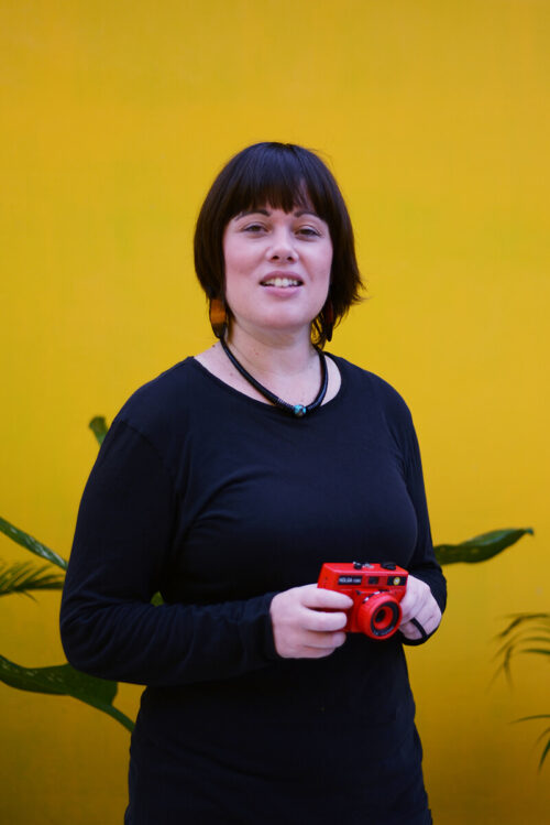 Willow holding a red camera