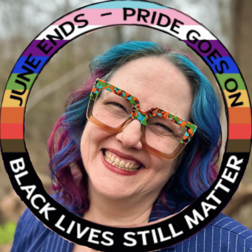 Katie Helms has colorful rainbow hair and wears a blue blazer with pinstripes, and large brown and rainbow frames on her face. The text in a circle around her face says, "June ends - Pride goes on. Black lives still matter."